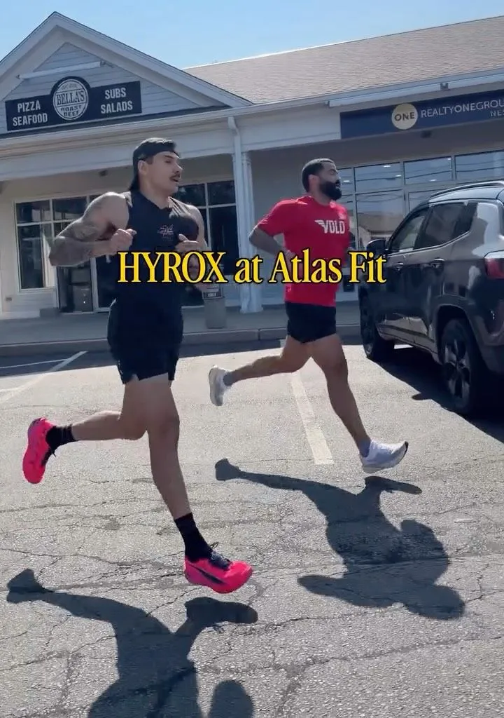 Members running outside during a HYROX session