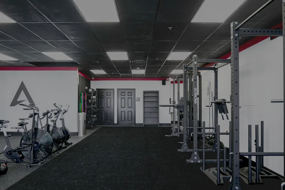 Rogue racks, sleds and Assault bikes on the turf